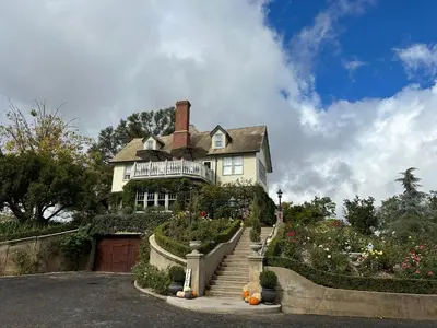 a house on top of a hill with stairs at The Inn on Knowles Hill Bed & Breakfast Hotel in Sonora