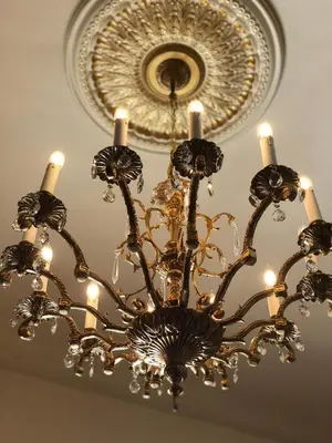 a chandelier with three candles on a ceiling at The Inn on Knowles Hill Bed & Breakfast Hotel in Sonora