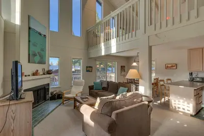 a living room with two couches and a tv at Sunny Daze at Dollar Point by Tahoe Getaways - Tahoe Classic w Open Floor Plan, Wood Fireplace, Close to Lake! in Tahoe City