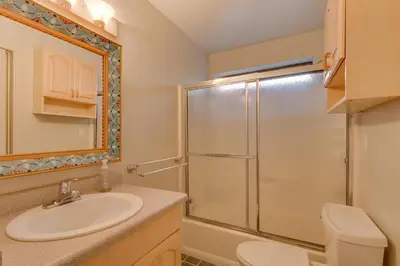 a bathroom with a sink and a shower at Sunny Daze at Dollar Point by Tahoe Getaways - Tahoe Classic w Open Floor Plan, Wood Fireplace, Close to Lake! in Tahoe City