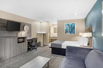 a hotel room with a bed and a desk at Best Western Big Country Inn in Coalinga