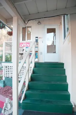 a stairway leading to a door of a house at El Dorado Motel in Twain Harte