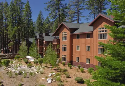 an exterior view of a large building with trees at WorldMark South Shore in Zephyr Cove