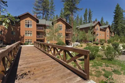 a wooden bridge in front of a building at WorldMark South Shore in Zephyr Cove