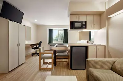 a living room with a kitchen and a dining room at Microtel Inn & Suites Lodi in Lodi