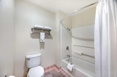 a bathroom with a toilet and a shower at Best Western Capital City Inn in Sacramento