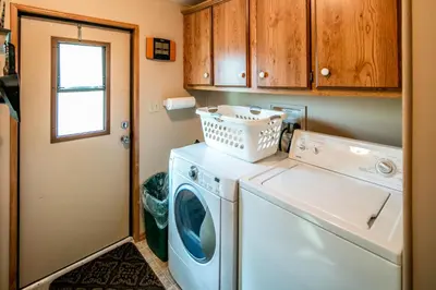 a laundry room with a washer and dryer at Yosemite Cabin in Wawona