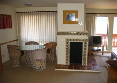 a living room with a fireplace and a tv at Rr-interlaken 26 in June Lake