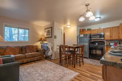 a living room with a couch and a table at Birch Creek #1 - 1BR/1BA - Down Canyon in June Lake