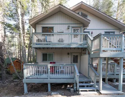 a house with a large deck and a porch at Birch Creek #1 - 1BR/1BA - Down Canyon in June Lake