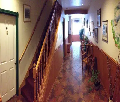 a hallway with a staircase in a house at StrawberryInn River Front Resort in Strawberry