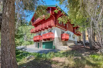 a house with red balconies on the side of it at Vienna Villa - 3 Bed 3 Bath Vacation home in Shaver Lake in Shaver Lake