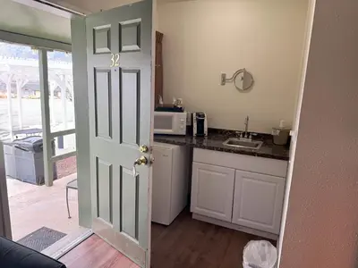 a kitchen with a sink and a counter top at Lakeshore Lodge in Wofford Heights