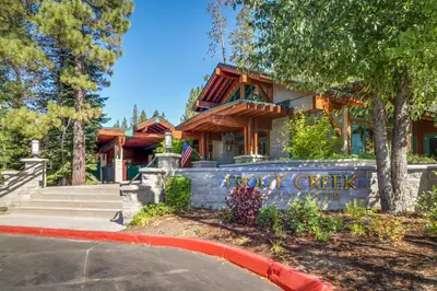 a house with a sign that says not check at Tahoe Donner Tree House Retreat in Truckee