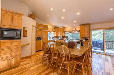 a kitchen with a large table and chairs in a kitchen at Beautiful 3500sf Lake Tahoe Home W/ Open Layout in Zephyr Cove