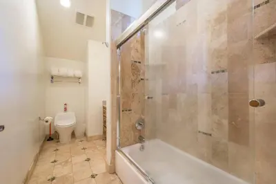 a bathroom with a shower and a toilet at Skislope-Tahoe Villa in Truckee