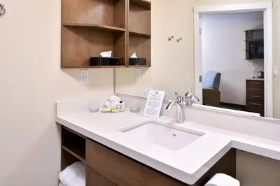 a bathroom with a sink and a mirror at Candlewood Suites - Lodi by IHG in Lodi
