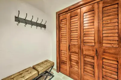 a large wooden closet with a bench in a room at Steps From Heavenly Village & Gondola-Luxury 3Br Residence Condo in South Lake Tahoe