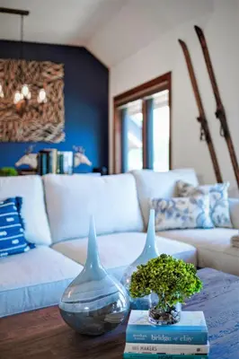 a living room with a couch and two vases on a table at Luxury Two Bedroom Residence Steps From Heavenly Village Condo in South Lake Tahoe