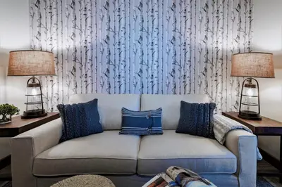 a living room with a couch and two lamps at Luxury Two Bedroom Residence Steps From Heavenly Village Condo in South Lake Tahoe