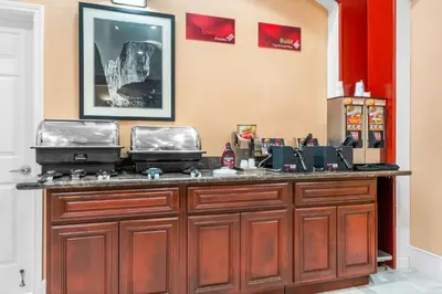 a bar with a dog on top of it at Best Western Plus Yosemite Way Station in Mariposa