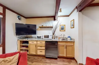 a kitchen with a television and a counter top at Creekside Retreat in Incline Village