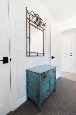 a room with a blue dresser and a mirror at Moon Ranch - a gateway to Yosemite in Mariposa
