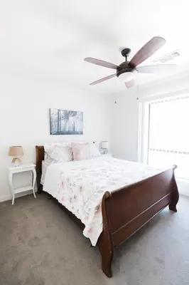 a bedroom with a bed and a ceiling fan at Moon Ranch - a gateway to Yosemite in Mariposa