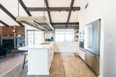 a kitchen with white cabinets and a white counter top at Moon Ranch - a gateway to Yosemite in Mariposa