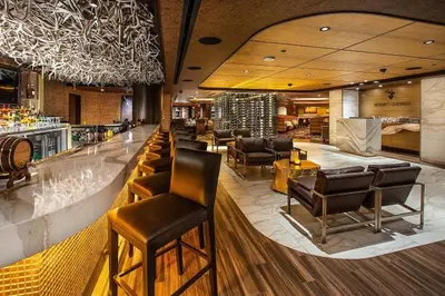 a lobby with chairs and a bar in a hotel at Nugget Casino Resort in Reno