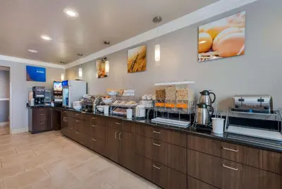 a restaurant with a counter with food on it at Comfort Inn Gilroy in Gilroy