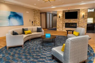 a living room with two couches and a fireplace at Homewood Suites By Hilton Rancho Cordova, Ca in Rancho Cordova