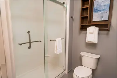 a bathroom with a toilet and a glass shower at Homewood Suites By Hilton Rancho Cordova, Ca in Rancho Cordova