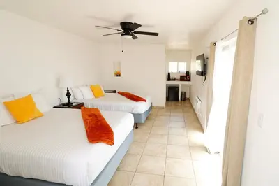 a bedroom with two beds and a ceiling fan at Sequoia Village in Three Rivers