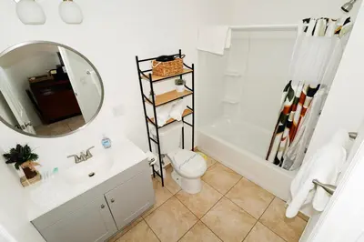 a bathroom with a sink toilet and a mirror at Sequoia Village in Three Rivers