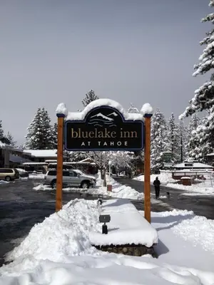 a sign for blueknife inn at k lodge in the snow at Bluelake Inn @ Heavenly Village in South Lake Tahoe