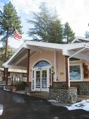 a building with an american flag in front of it at Bluelake Inn @ Heavenly Village in South Lake Tahoe