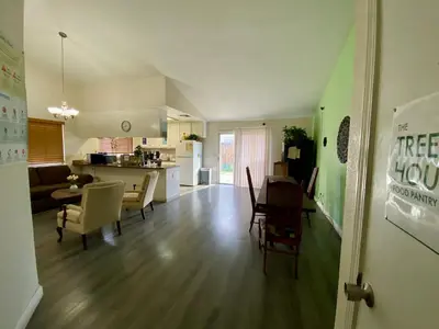 a kitchen and living room with a table and chairs at WHOLE Family - Wolfgram in Sacramento