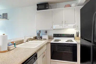 a kitchen with a sink and a stove at Bigwood 13 in Mammoth Lakes