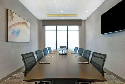 a conference room with a long table and chairs at Hampton Inn Patterson, Ca in Patterson