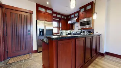 a kitchen with wooden cabinets and a counter top at Juniper Crest #7 Condo in Mammoth Lakes