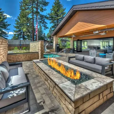 a patio with a fire pit in a yard at Hampton Inn & Suites South Lake Tahoe in South Lake Tahoe