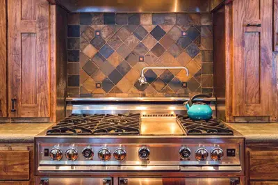 a kitchen stove with a tea kettle on top of it at Bear Meadows Lodge - Hot Tub - Tahoe Donner Home in Truckee