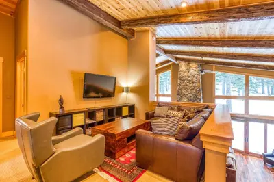a living room with a couch and a tv at Bear Meadows Lodge - Hot Tub - Tahoe Donner Home in Truckee