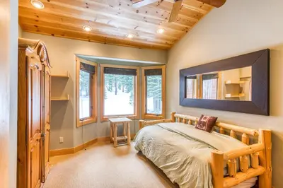 a bedroom with a bed and a wooden ceiling at Bear Meadows Lodge - Hot Tub - Tahoe Donner Home in Truckee