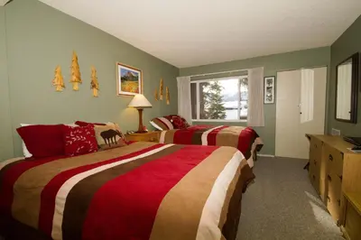 a bedroom with two beds and a window at Mammoth Ski Racquet Club 82 in Mammoth Lakes