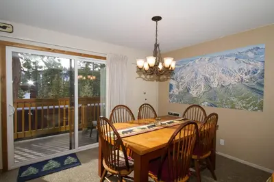 a dining room with a wooden table and chairs at Mammoth Ski Racquet Club 82 in Mammoth Lakes