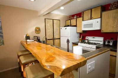 a kitchen with a wooden counter top in a room at Mammoth Ski Racquet Club 82 in Mammoth Lakes
