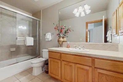 a bathroom with a toilet and a shower and a sink at Agate Road Retreat in Carnelian Bay