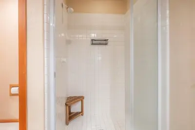a bathroom with a shower with white tiles at Snowcreek V 756 in Mammoth Lakes